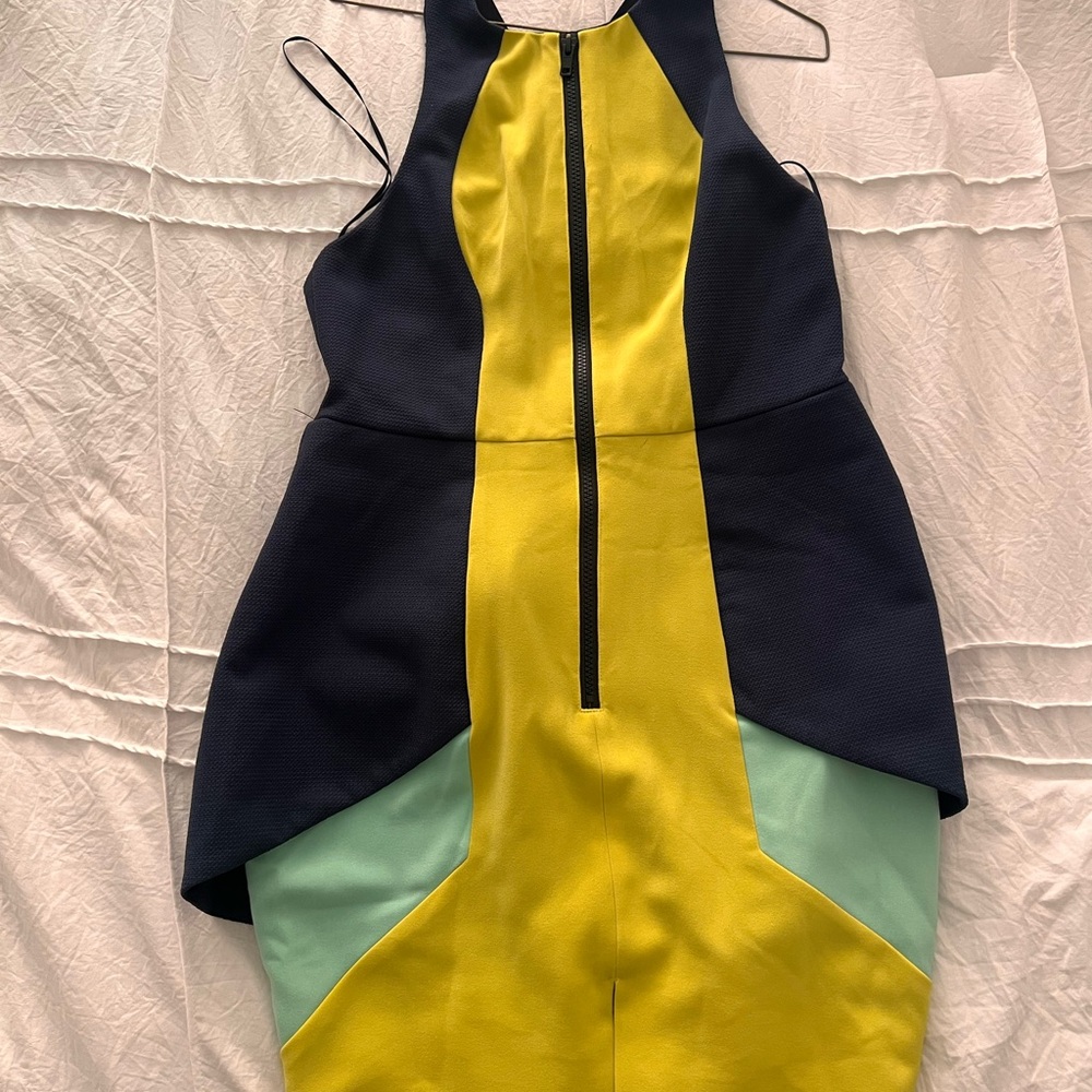 Dress design in Australia. Navy blue, green, yellow color.